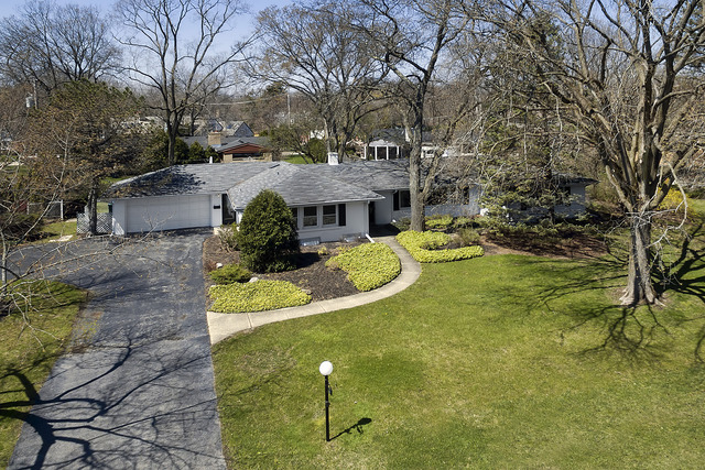 918 Lee Road Northbrook, IL 60062 - Photo 2 of 17 a view of a house with swimming pool and sitting area
