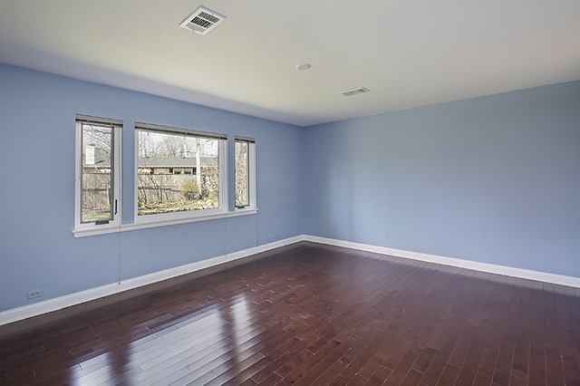 918 Lee Road Northbrook, IL 60062 - Photo 9 of 17 a view of an empty room with wooden floor and a window