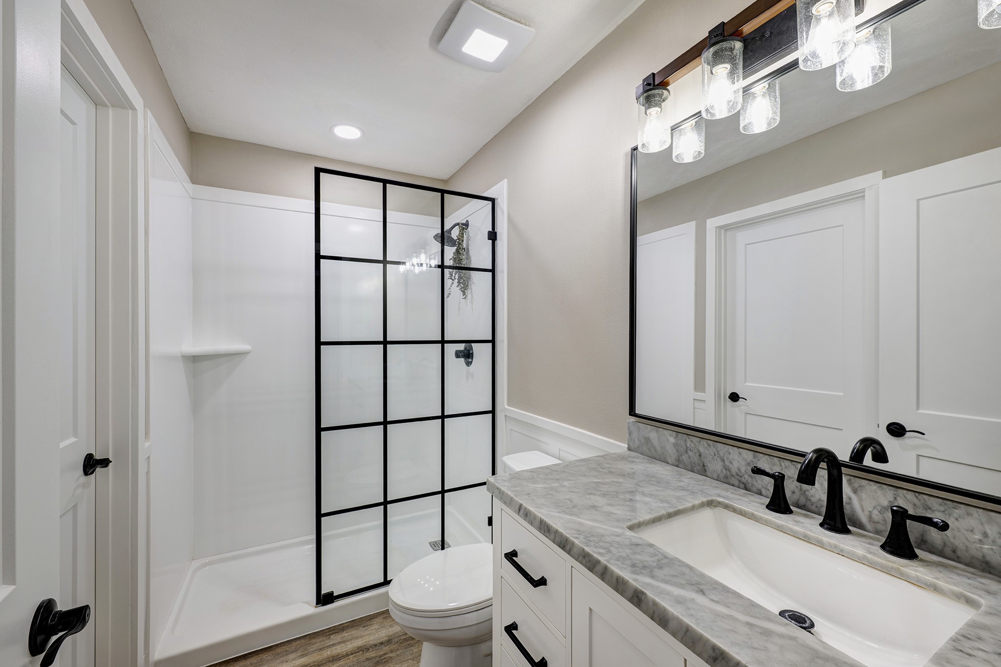 1911 North Red Cedar Circle Spring, TX 77380 - Photo 7 of 14 a bathroom with a granite countertop sink mirror vanity and toilet