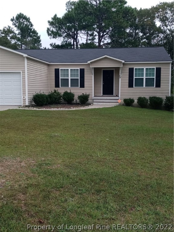 89 Jamestown Drive Spring Lake, NC 28390 - Photo 1 of 13 a front view of house with yard and green space