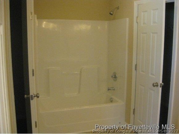 89 Jamestown Drive Spring Lake, NC 28390 - Photo 11 of 13 a bathroom with a bathtub