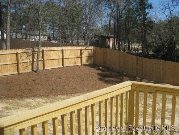 89 Jamestown Drive Spring Lake, NC 28390 - Photo 12 of 13 a view of wooden fence and trees