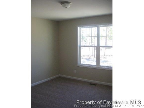89 Jamestown Drive Spring Lake, NC 28390 - Photo 7 of 13 a view of an empty room with a window