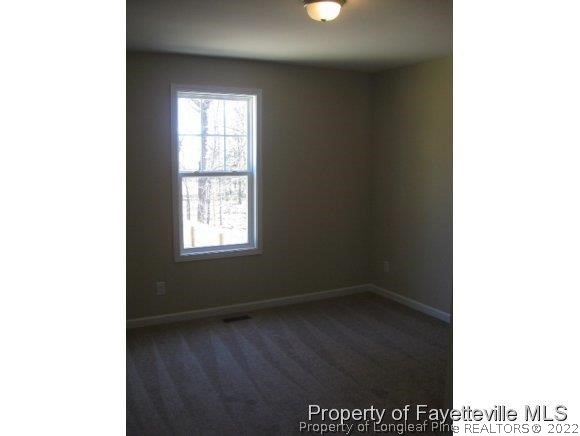 89 Jamestown Drive Spring Lake, NC 28390 - Photo 8 of 13 a view of an empty room with a window