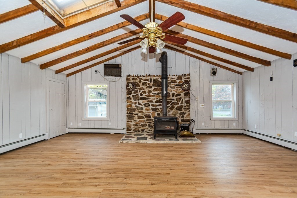 35 Bernadette Street Fitchburg, MA 01420 - Photo 4 of 19 a view of an empty room with a window and wooden floor