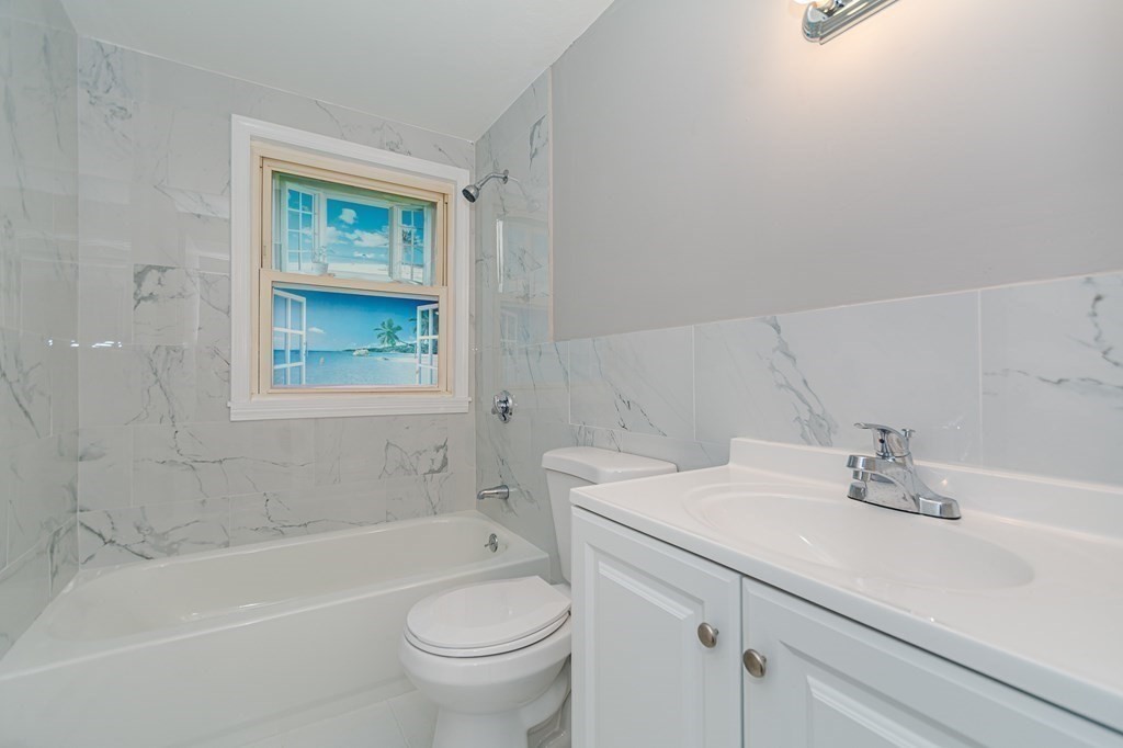 35 Bernadette Street Fitchburg, MA 01420 - Photo 6 of 19 a bathroom with a sink a toilet and shower