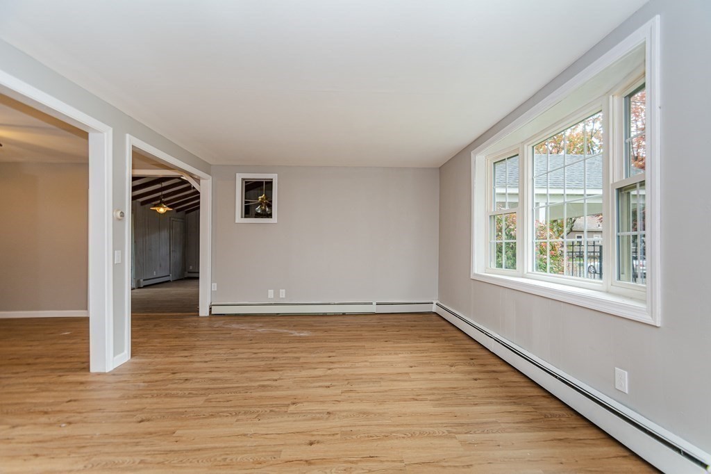 35 Bernadette Street Fitchburg, MA 01420 - Photo 7 of 19 a view of an empty room with wooden floor and a window