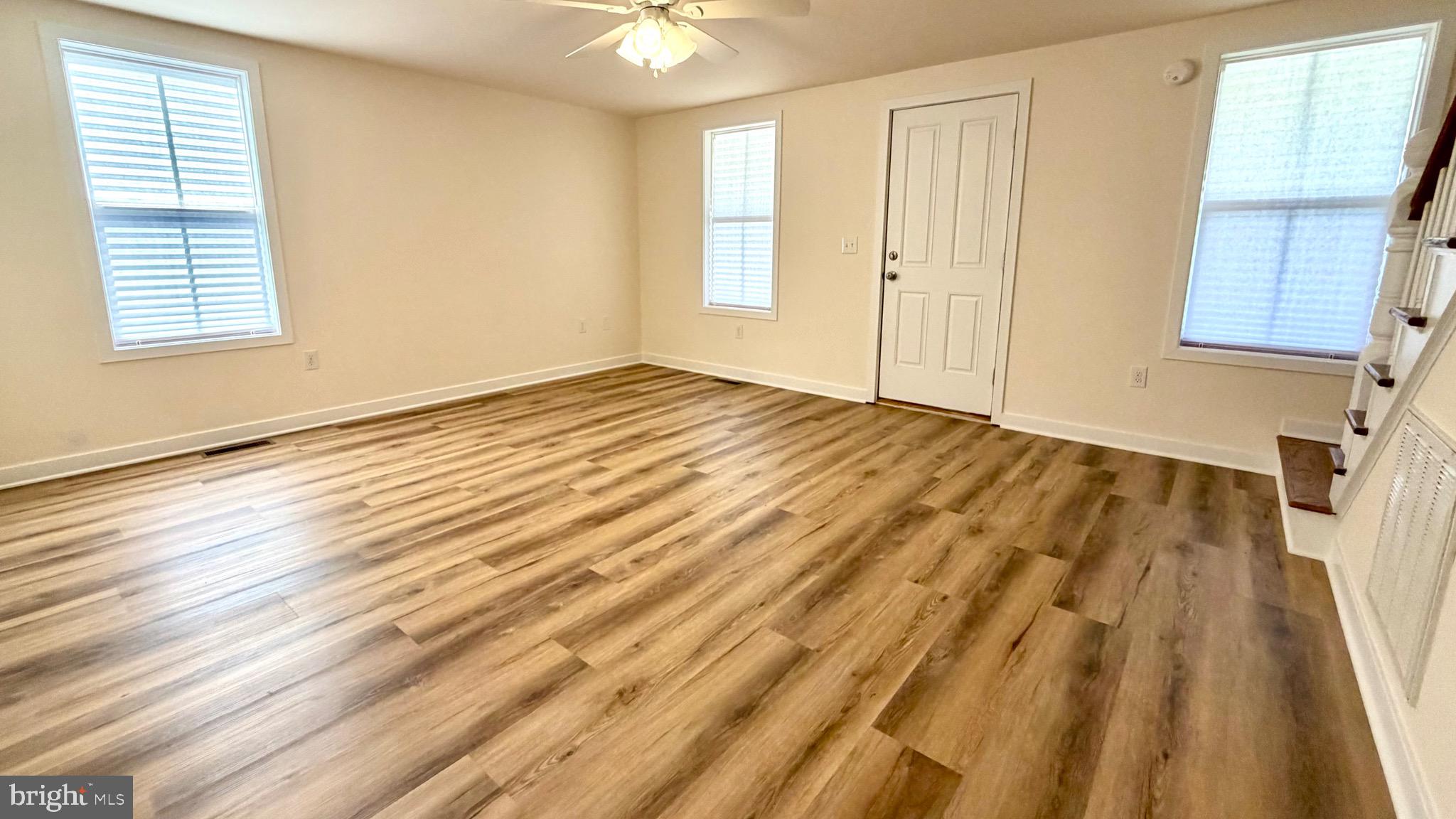 2697 Choptank Main Street Preston, MD 21655 - Photo 14 of 37 a view of an empty room with wooden floor and a window