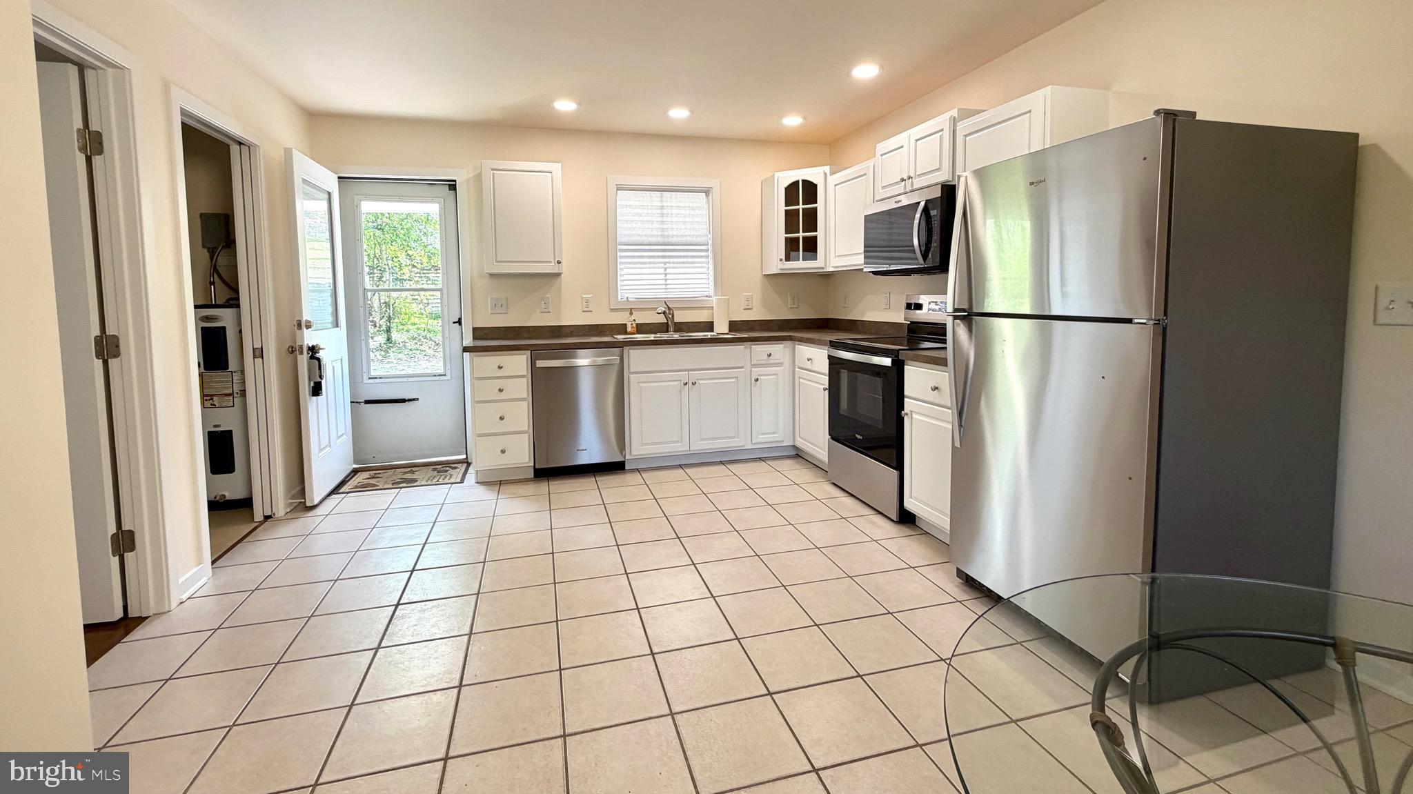 2697 Choptank Main Street Preston, MD 21655 - Photo 18 of 37 a kitchen with a refrigerator and a stove top oven