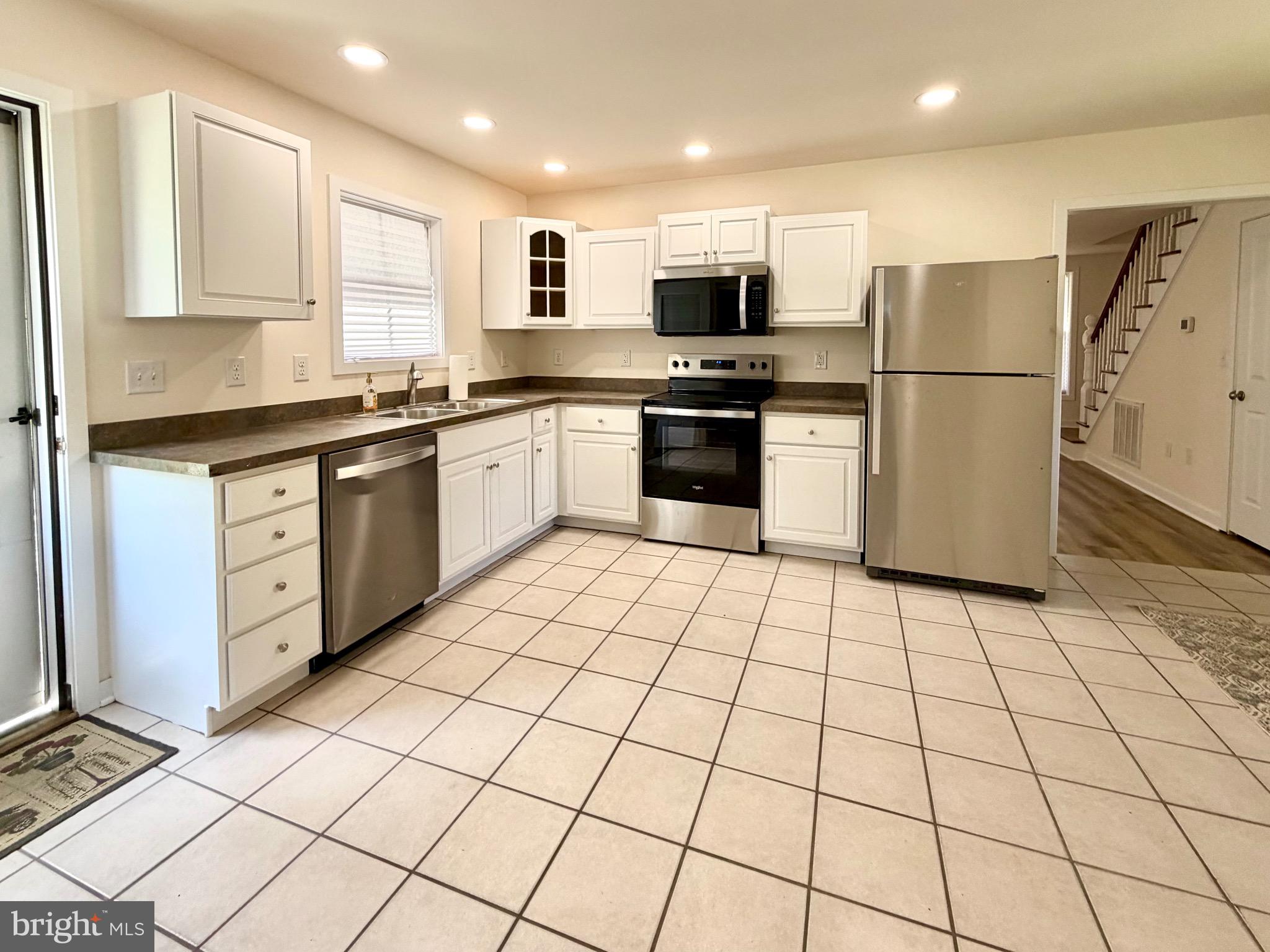 2697 Choptank Main Street Preston, MD 21655 - Photo 19 of 37 a kitchen with stainless steel appliances granite countertop a refrigerator sink and cabinets