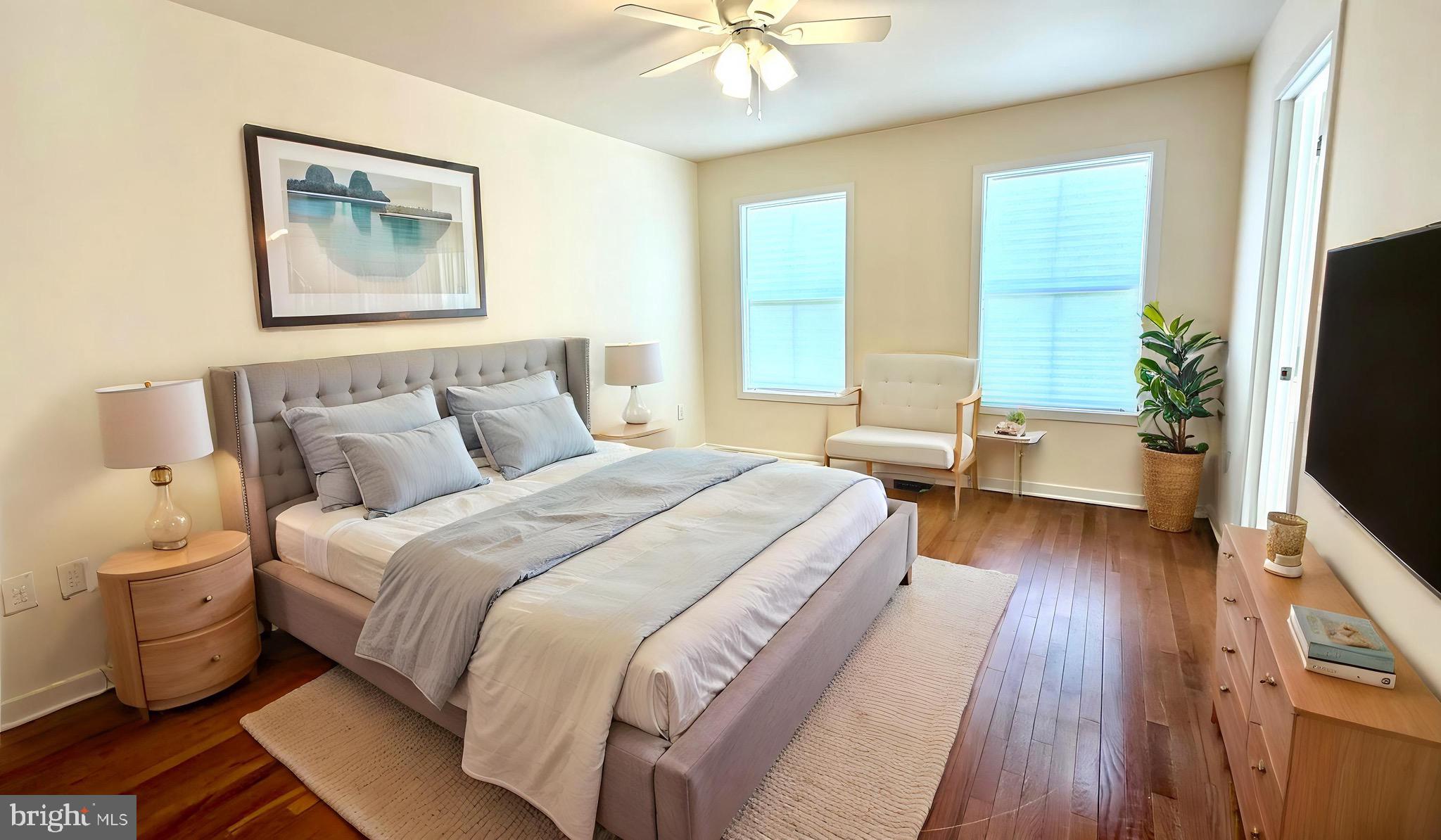 2697 Choptank Main Street Preston, MD 21655 - Photo 21 of 37 a spacious bedroom with a bed and a chandelier