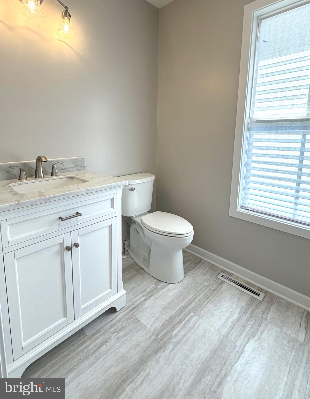 2697 Choptank Main Street Preston, MD 21655 - Photo 24 of 37 a bathroom with a toilet sink and window