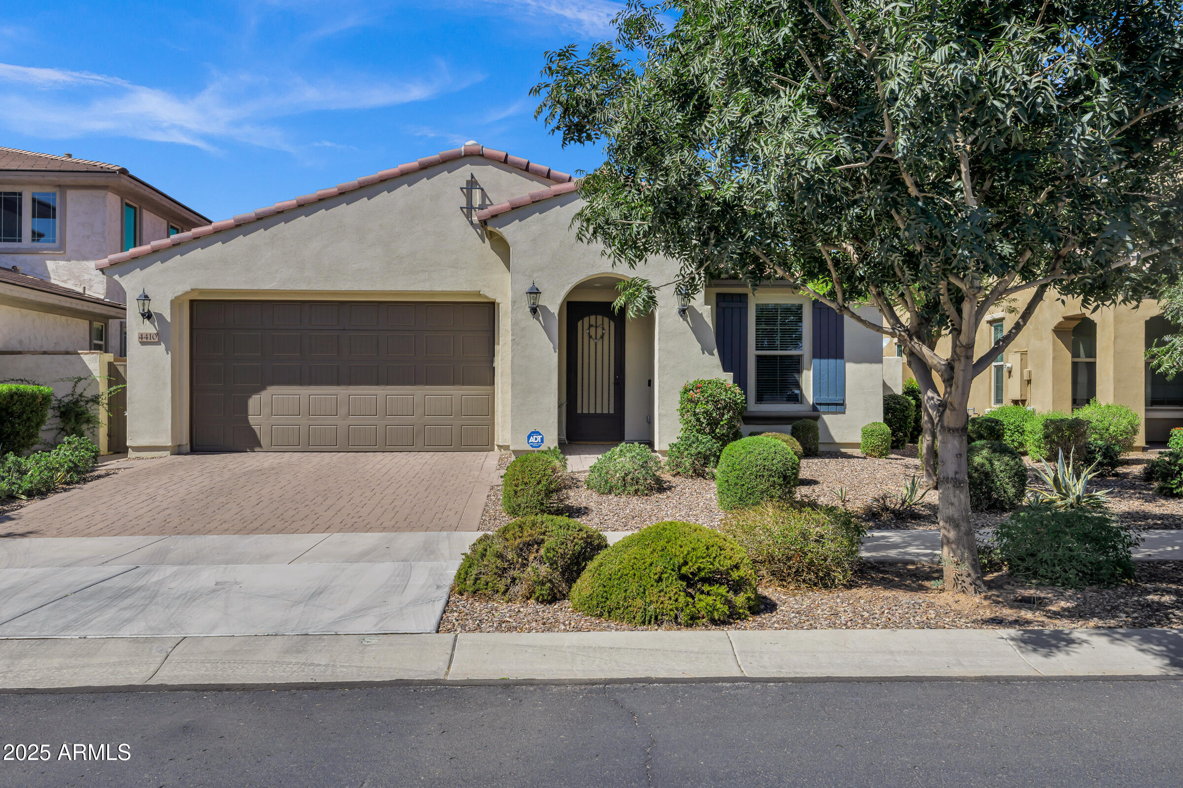 4410 South Intensity Mesa, AZ 85212 - Photo 1 of 28 a front view of a house with a yard and garage