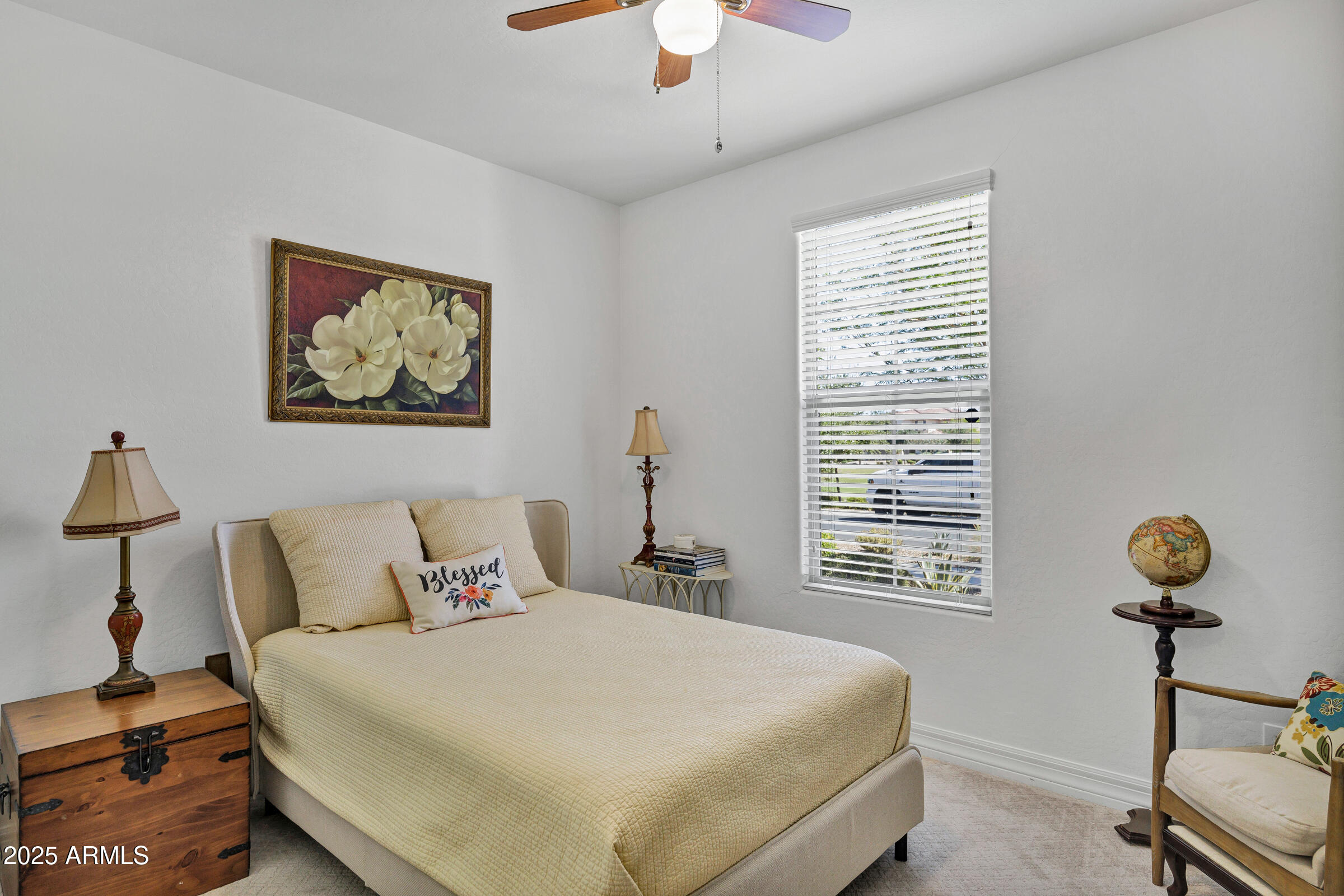 4410 South Intensity Mesa, AZ 85212 - Photo 16 of 28 a bedroom with a bed and a chandelier