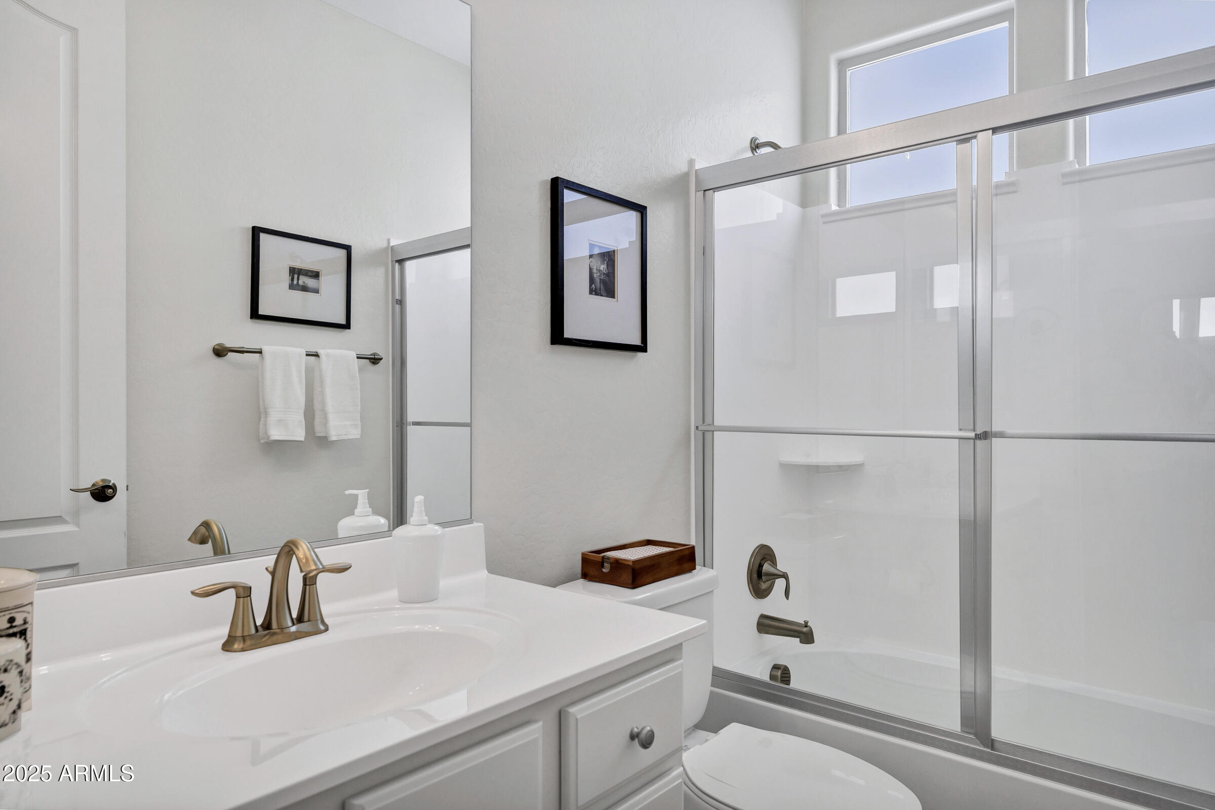4410 South Intensity Mesa, AZ 85212 - Photo 17 of 28 a bathroom with a sink toilet and shower