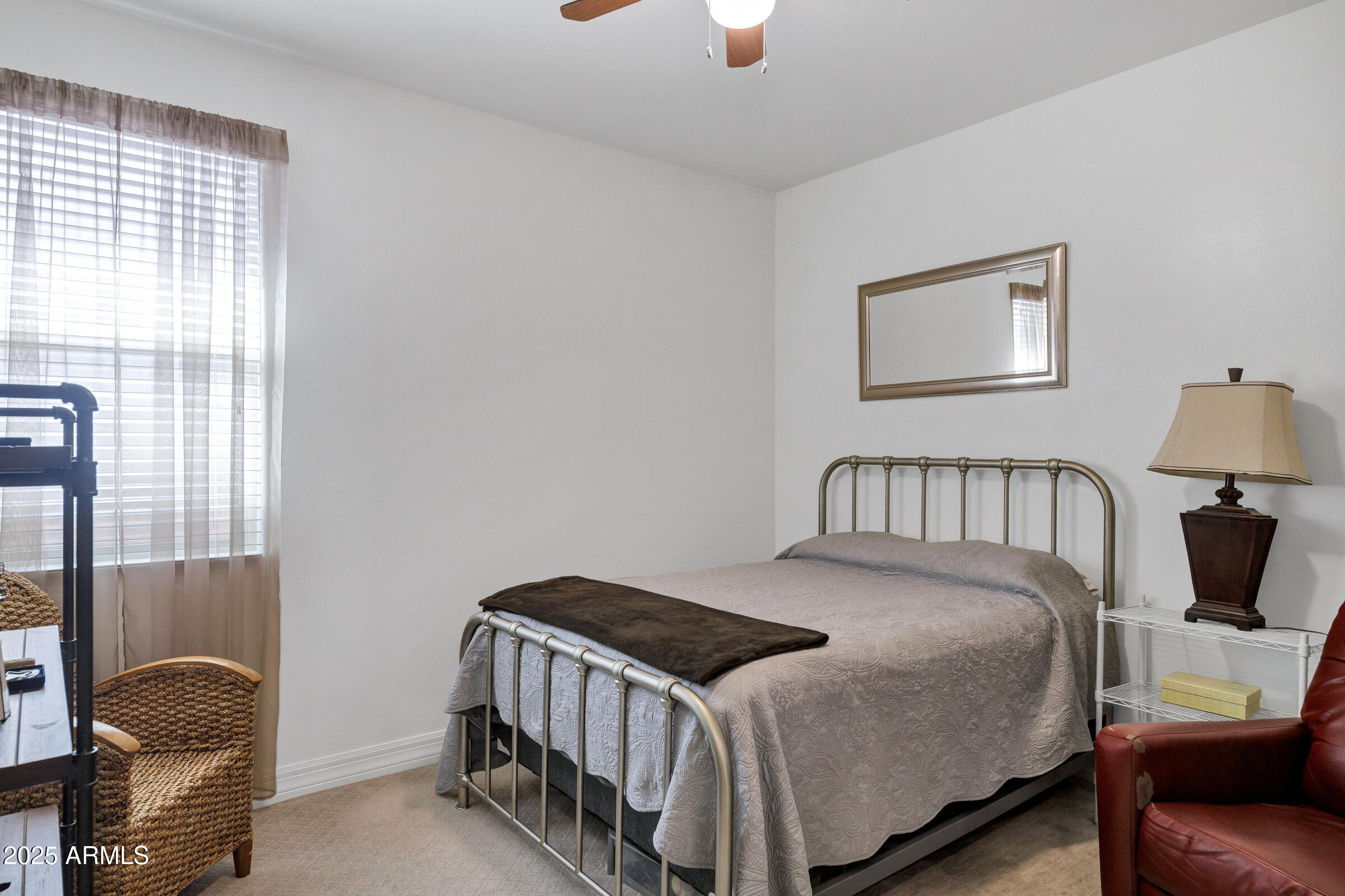 4410 South Intensity Mesa, AZ 85212 - Photo 19 of 28 a bedroom with a bed and window