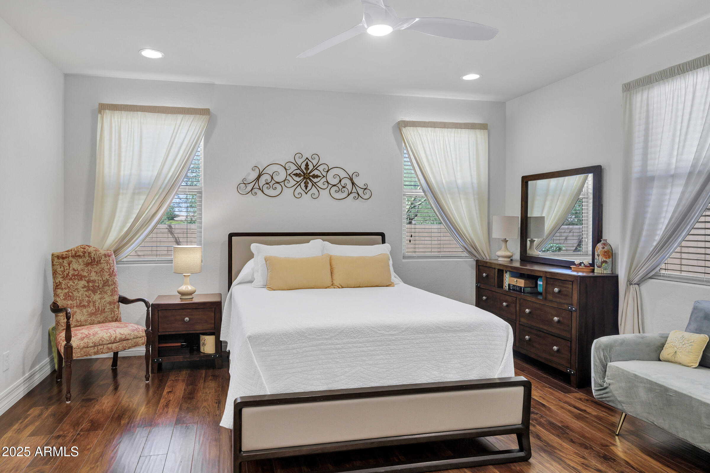 4410 South Intensity Mesa, AZ 85212 - Photo 21 of 28 a bedroom with a bed and wooden floor