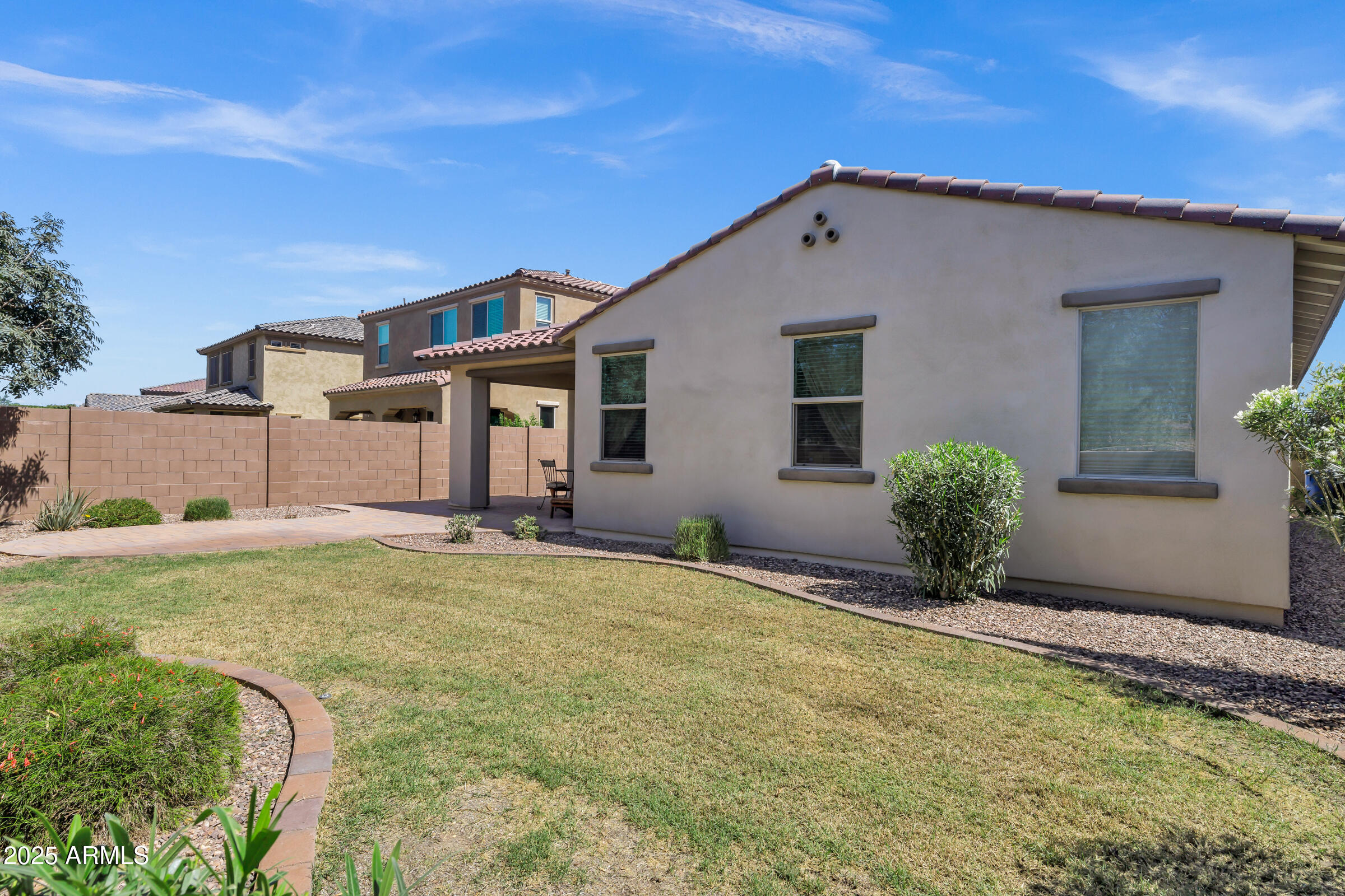 4410 South Intensity Mesa, AZ 85212 - Photo 26 of 28 a backyard of a house with table and chairs