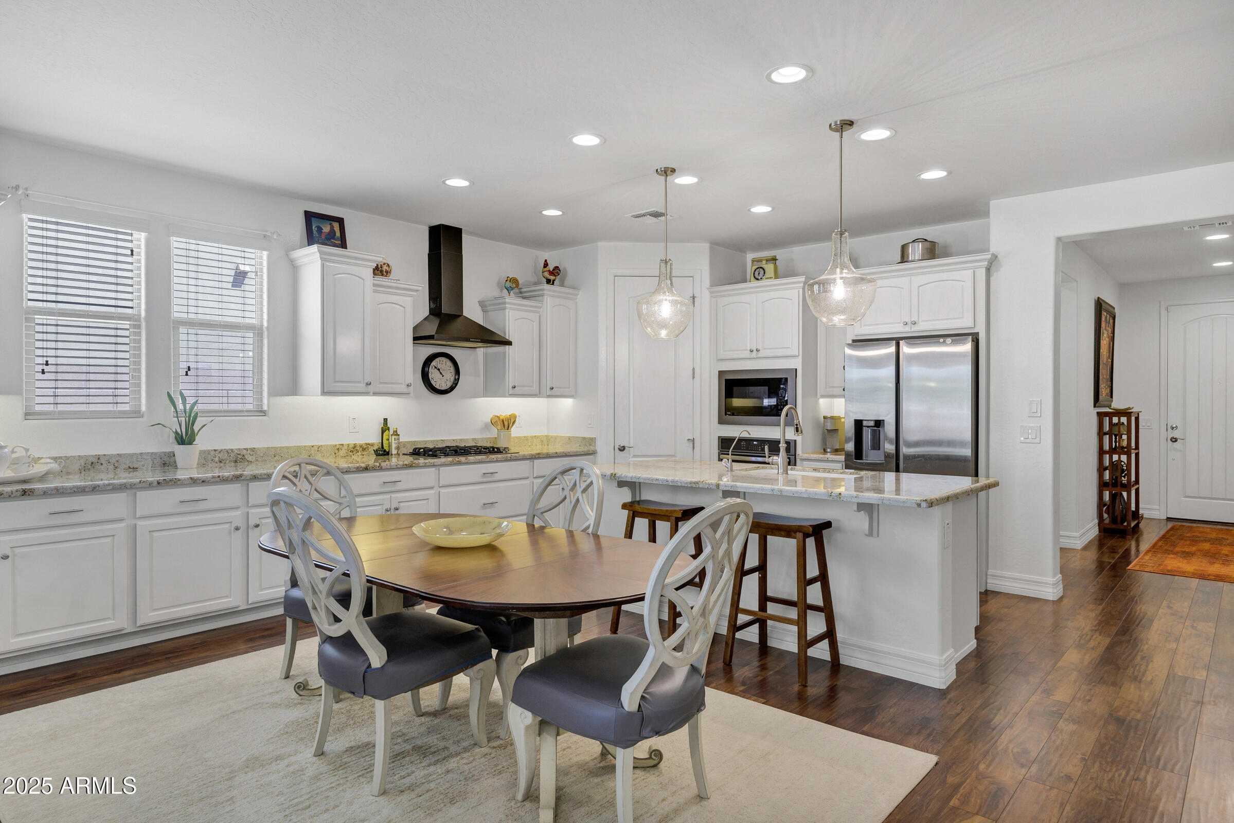 4410 South Intensity Mesa, AZ 85212 - Photo 8 of 28 a large kitchen with a table and chairs