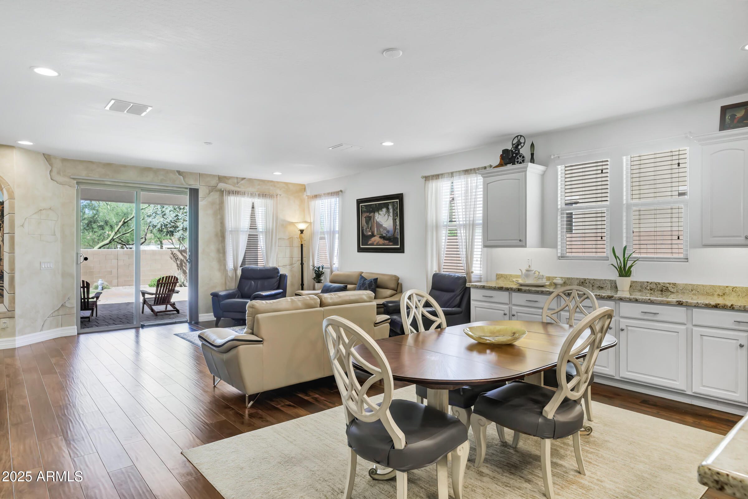 4410 South Intensity Mesa, AZ 85212 - Photo 9 of 28 a view of a dining room with furniture and wooden floor