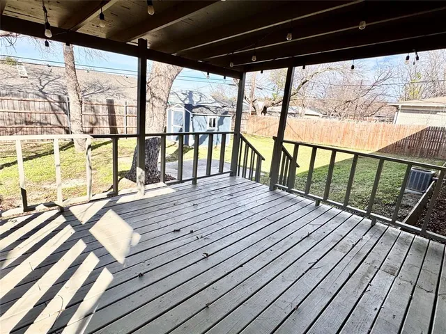a view of balcony with wooden floor