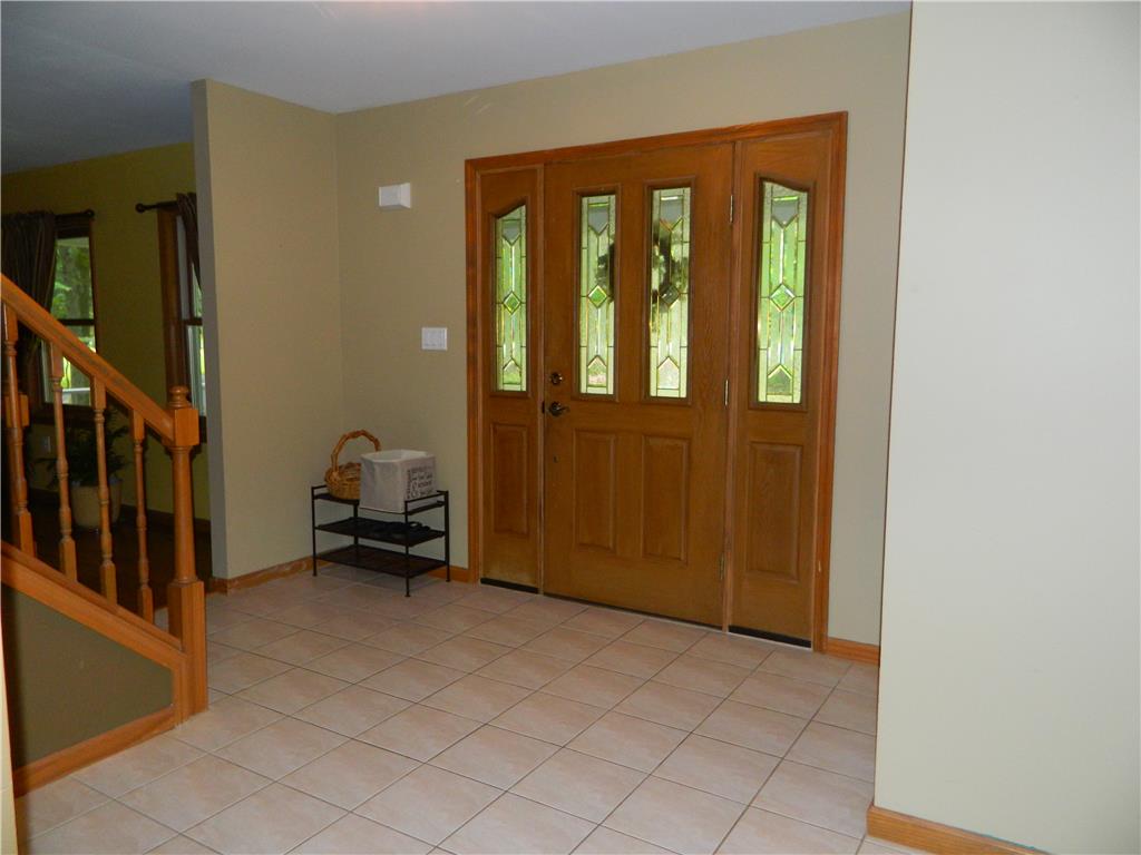 328 Pin Oak Road Stroudsburg, PA 18360 - Photo 10 of 42 A welcoming entry showcases a handsome front door with decorative glass panels and durable tile flooring.