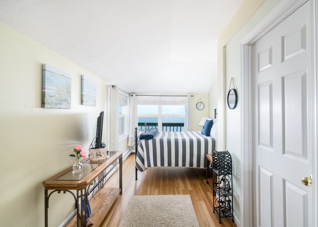 262 Manomet Point Road Plymouth, MA 02360 - Photo 14 of 40 a bedroom with furniture and a window