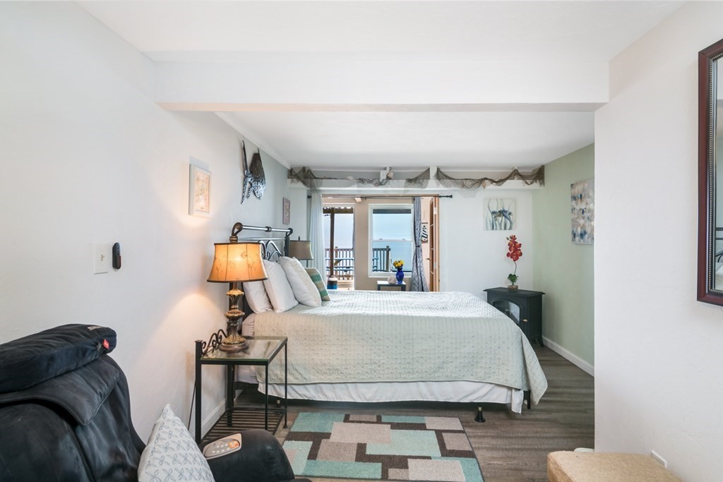 262 Manomet Point Road Plymouth, MA 02360 - Photo 16 of 40 a bedroom with a bed and window