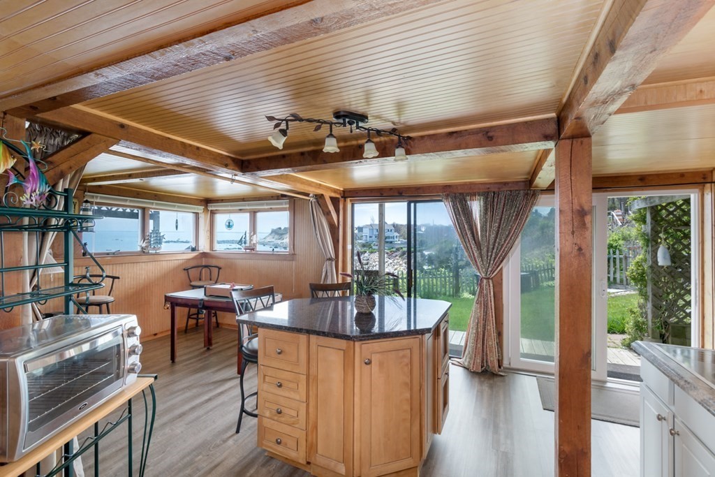 262 Manomet Point Road Plymouth, MA 02360 - Photo 23 of 40 a view of a dining room with furniture window and wooden floor