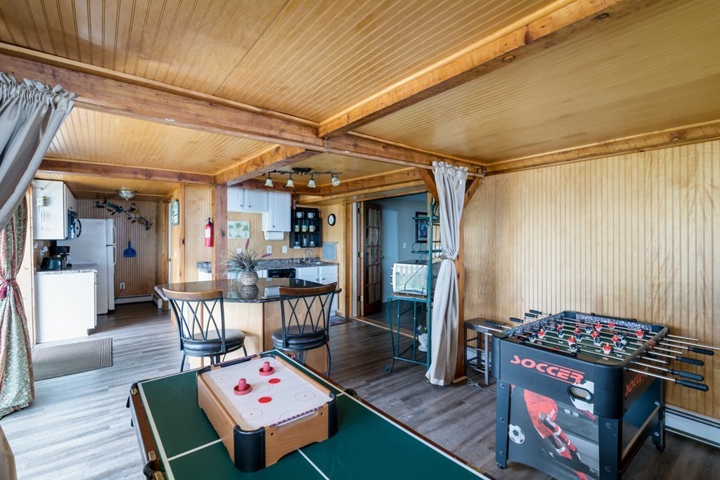 262 Manomet Point Road Plymouth, MA 02360 - Photo 24 of 40 a living room with furniture and a table