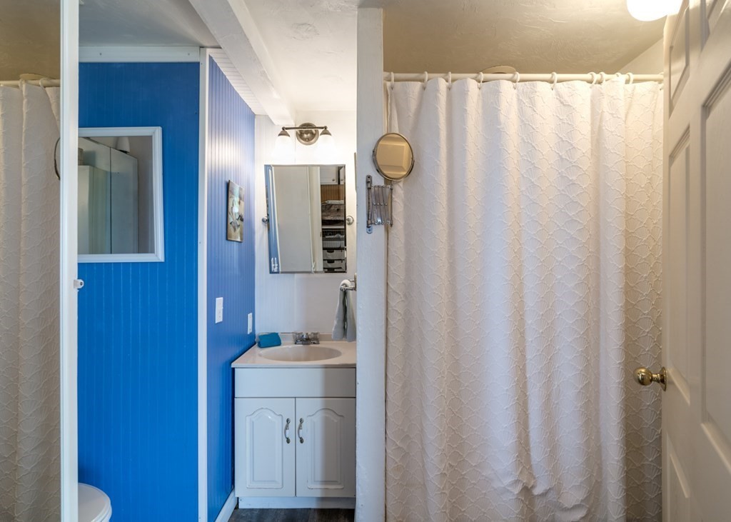 262 Manomet Point Road Plymouth, MA 02360 - Photo 25 of 40 a bathroom with a sink and a mirror
