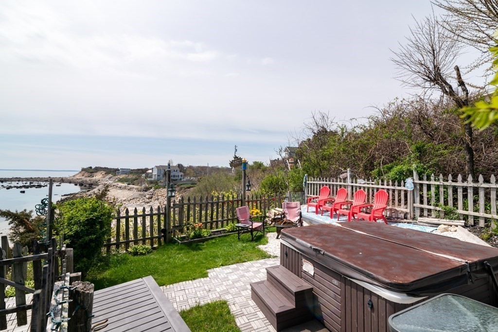 262 Manomet Point Road Plymouth, MA 02360 - Photo 32 of 40 a view of a terrace with wooden floor and fence