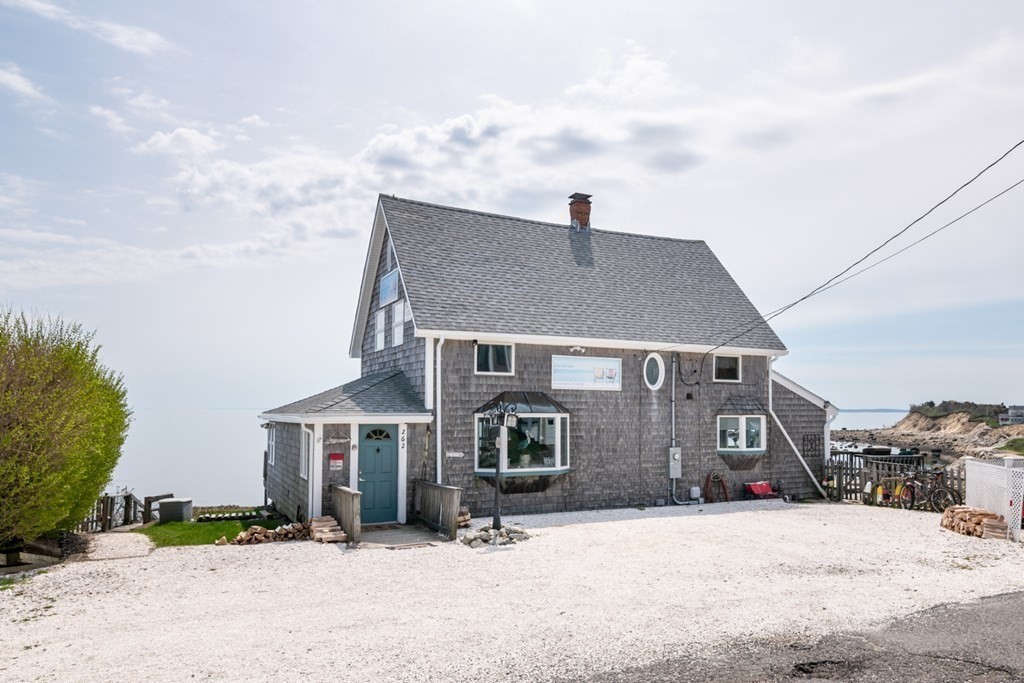 262 Manomet Point Road Plymouth, MA 02360 - Photo 33 of 40 a front view of a house with a yard