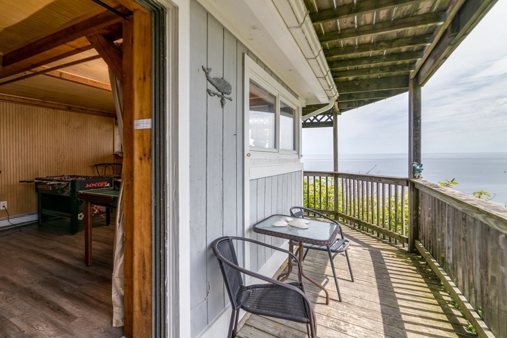 262 Manomet Point Road Plymouth, MA 02360 - Photo 35 of 40 a view of a balcony with furniture