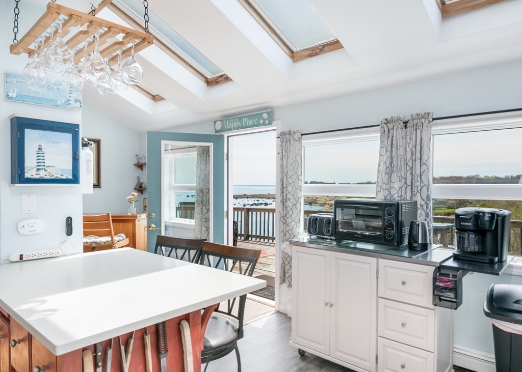 262 Manomet Point Road Plymouth, MA 02360 - Photo 6 of 40 a kitchen with a stove a sink and a refrigerator