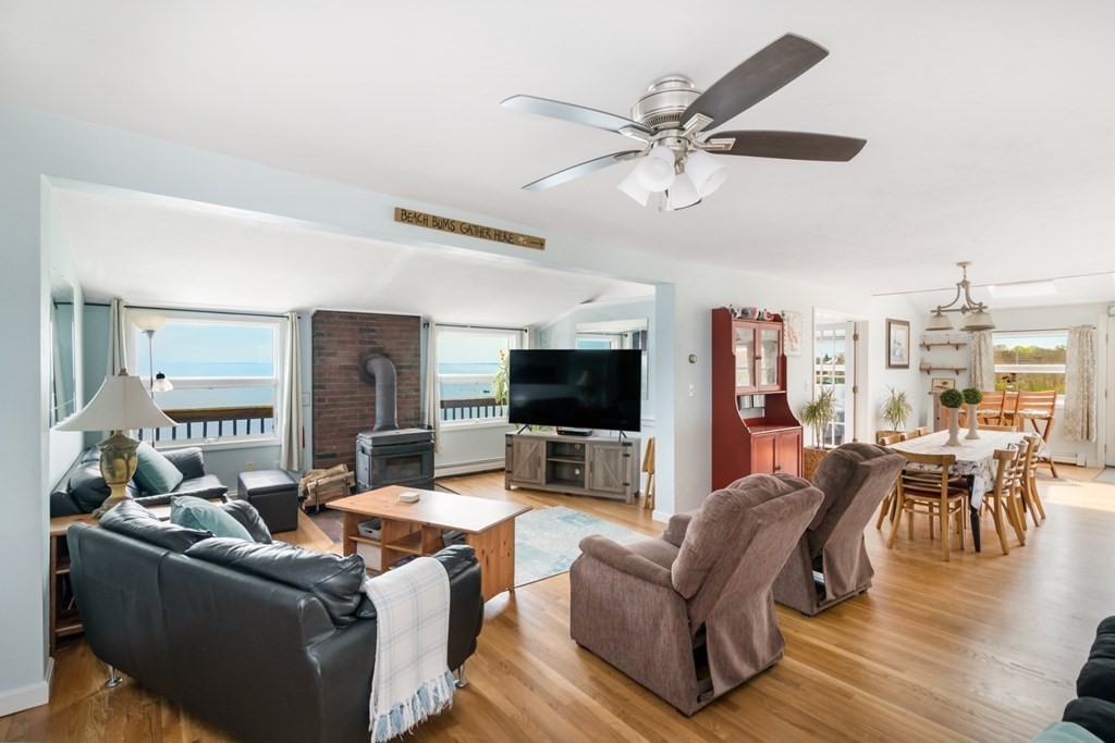262 Manomet Point Road Plymouth, MA 02360 - Photo 8 of 40 a living room with furniture and a flat screen tv