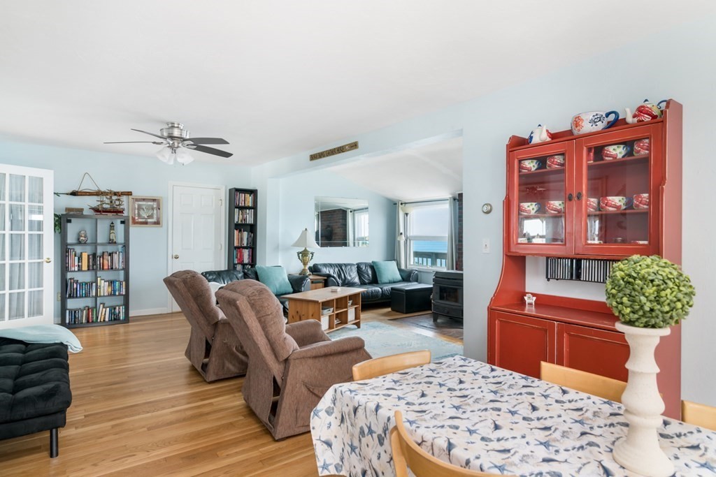 262 Manomet Point Road Plymouth, MA 02360 - Photo 10 of 40 a living room with furniture a rug and a chandelier