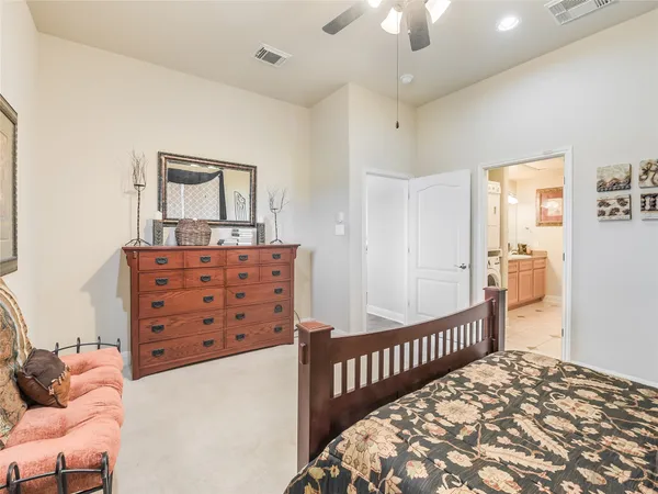 a bedroom with furniture and window