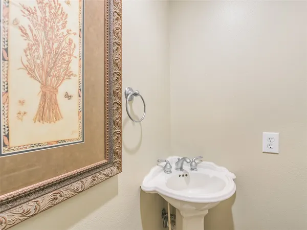 a en suite bathroom with a sink double vanity and a mirror