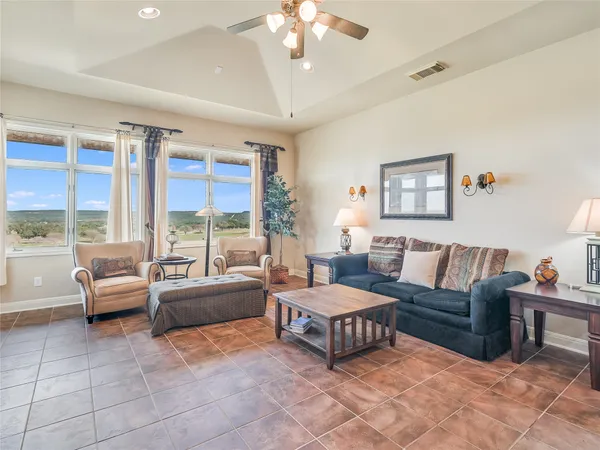 a living room with furniture and a large window