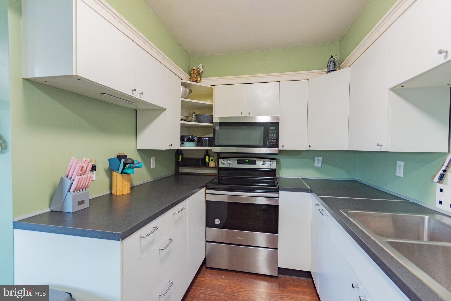 306 East 12th Avenue, Unit B Ranson, WV 25438 - Photo 11 of 31 a kitchen with granite countertop a sink and steel appliances