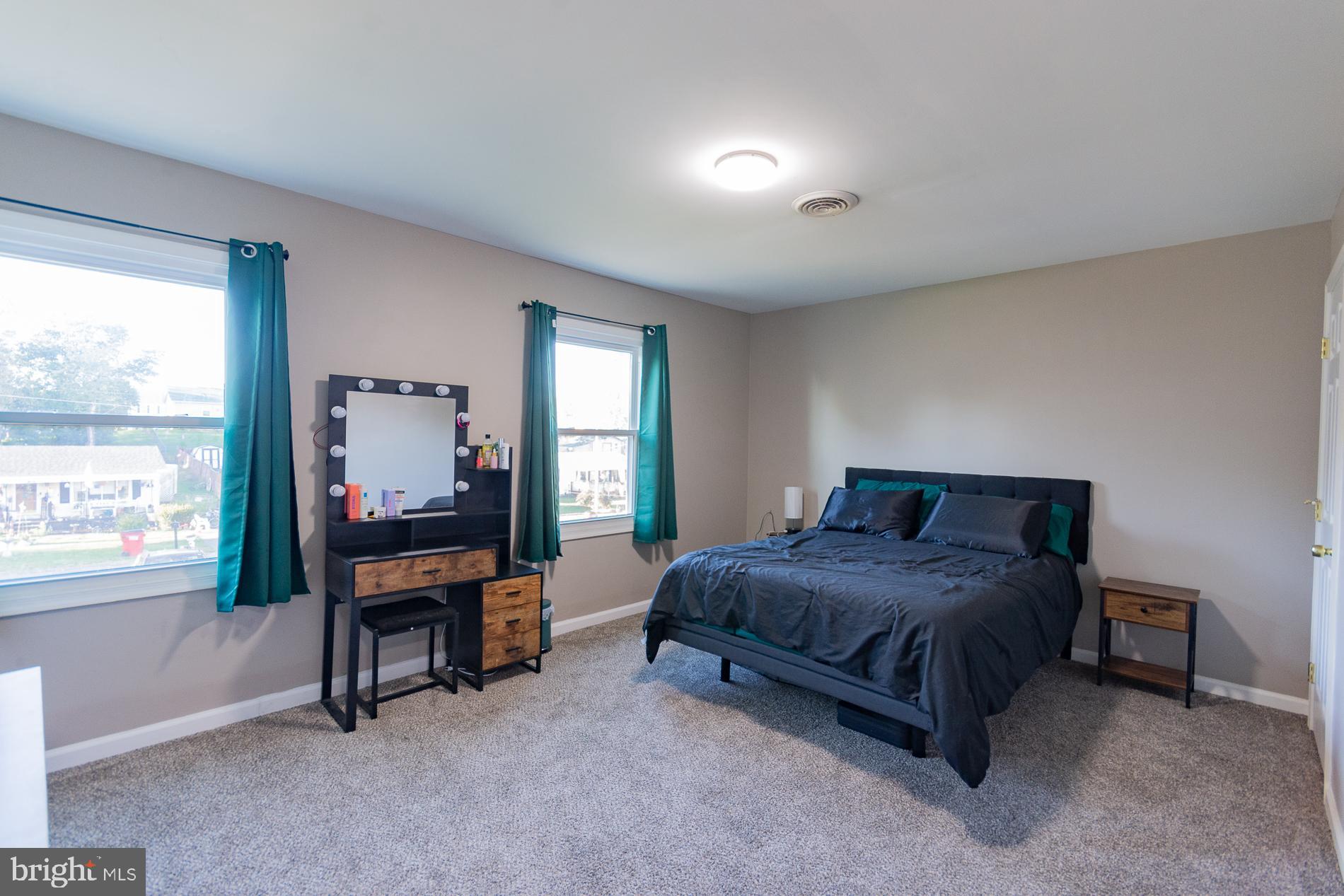 306 East 12th Avenue, Unit B Ranson, WV 25438 - Photo 15 of 31 a bedroom with a bed and a desk