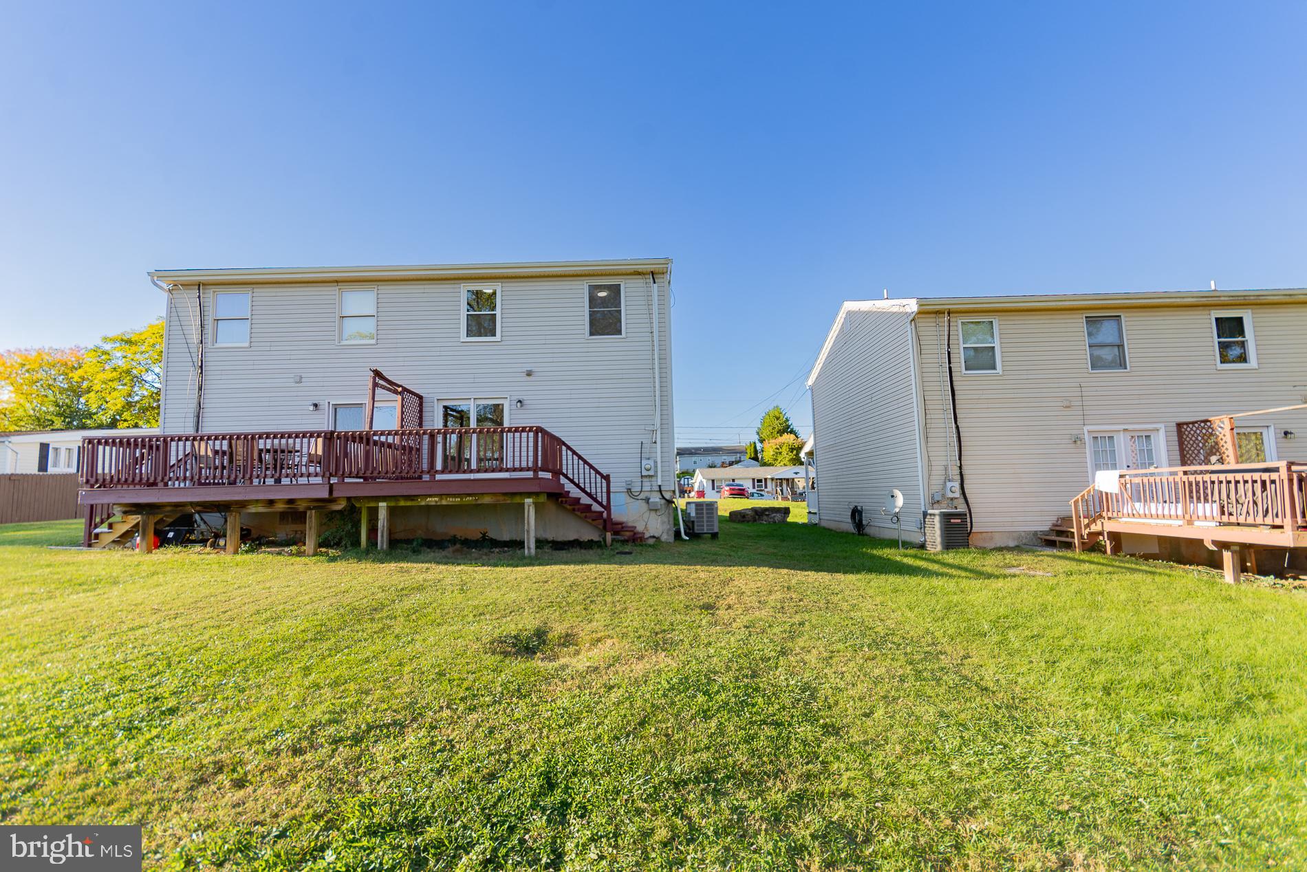 306 East 12th Avenue, Unit B Ranson, WV 25438 - Photo 23 of 31 a view of a house with a yard and sitting area