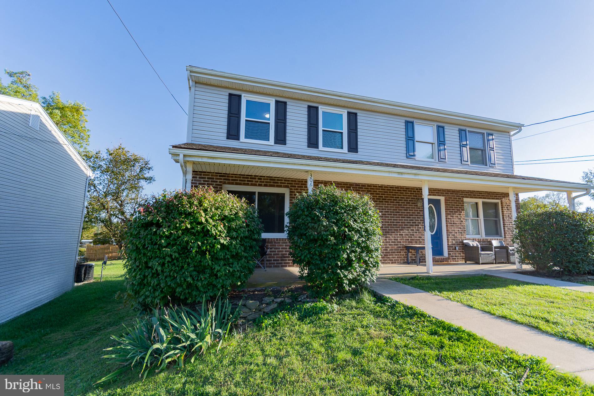 306 East 12th Avenue, Unit B Ranson, WV 25438 - Photo 29 of 31 front view of a house with a yard