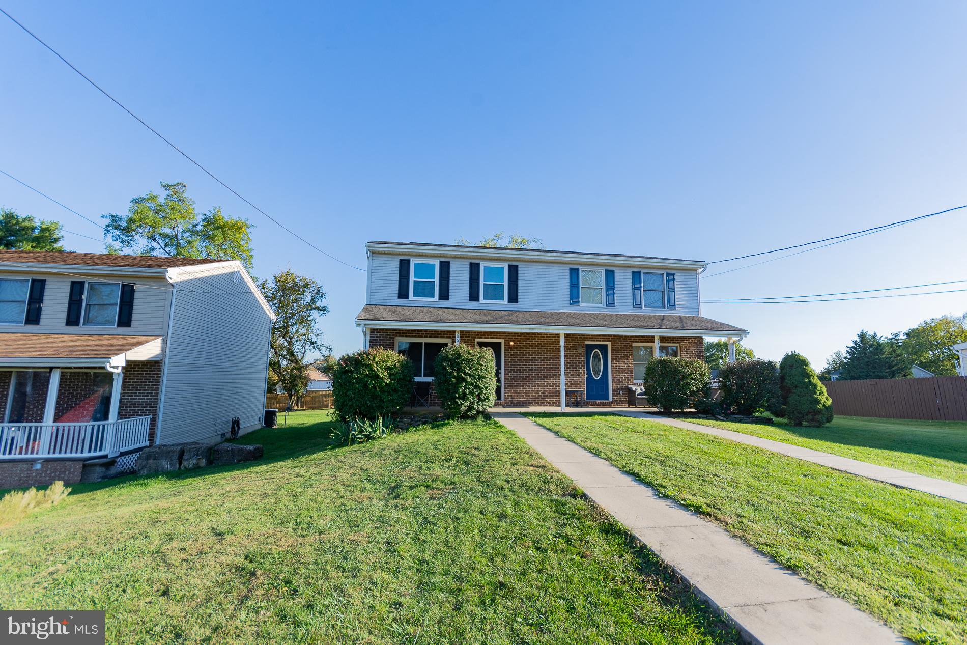 306 East 12th Avenue, Unit B Ranson, WV 25438 - Photo 30 of 31 front view of a house with a yard