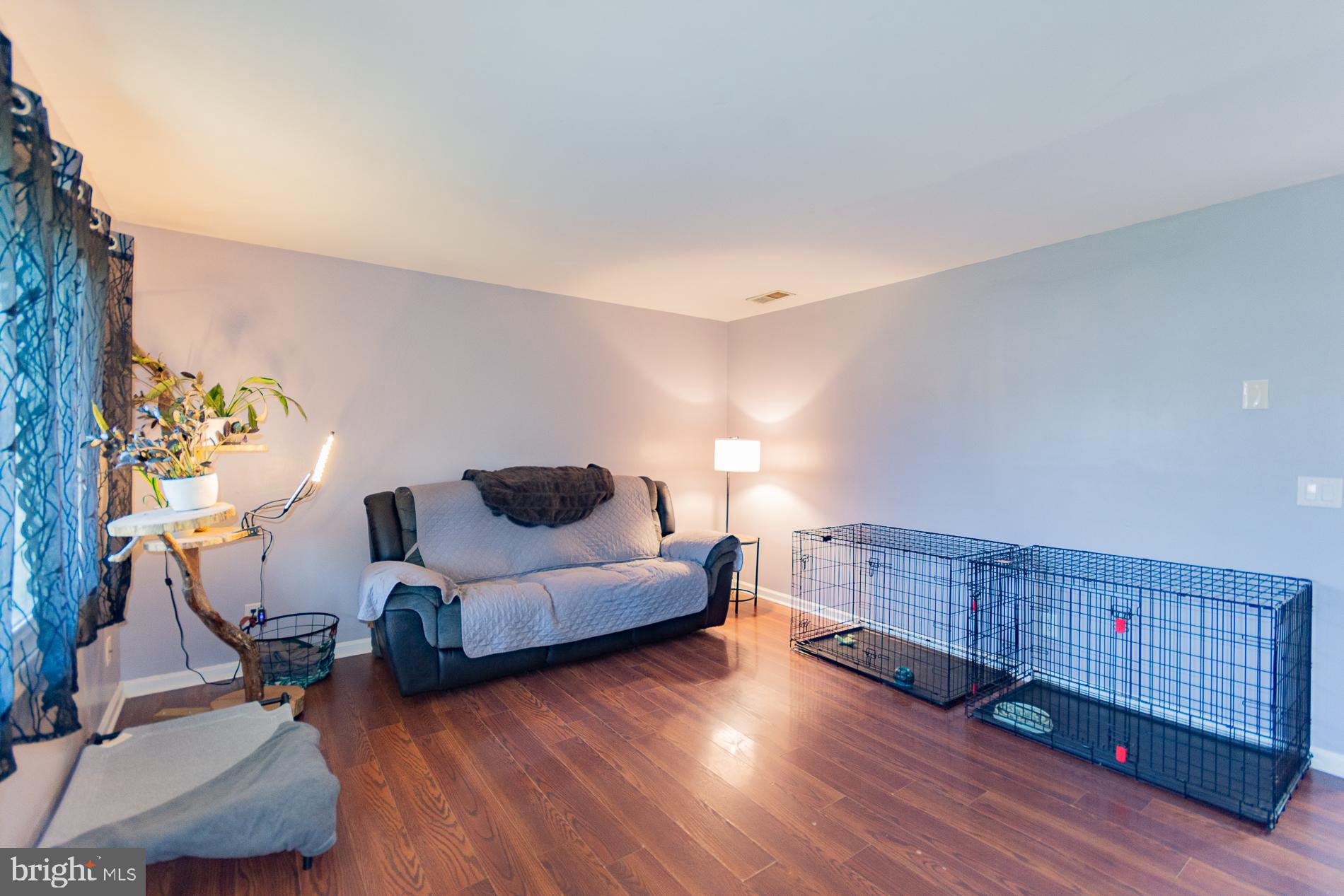 306 East 12th Avenue, Unit B Ranson, WV 25438 - Photo 3 of 31 a living room with furniture and a wooden floor
