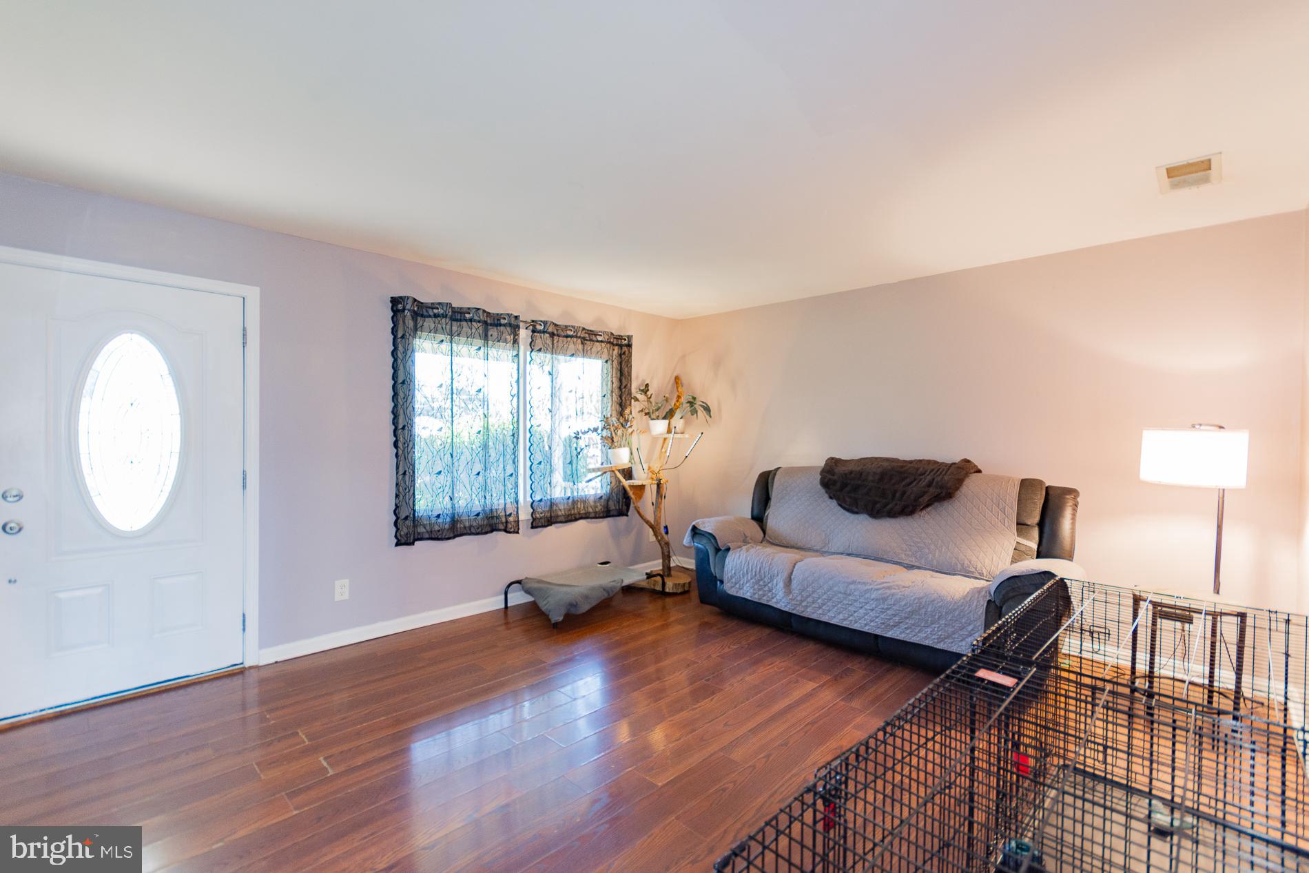 306 East 12th Avenue, Unit B Ranson, WV 25438 - Photo 4 of 31 a living room with furniture and wooden floor