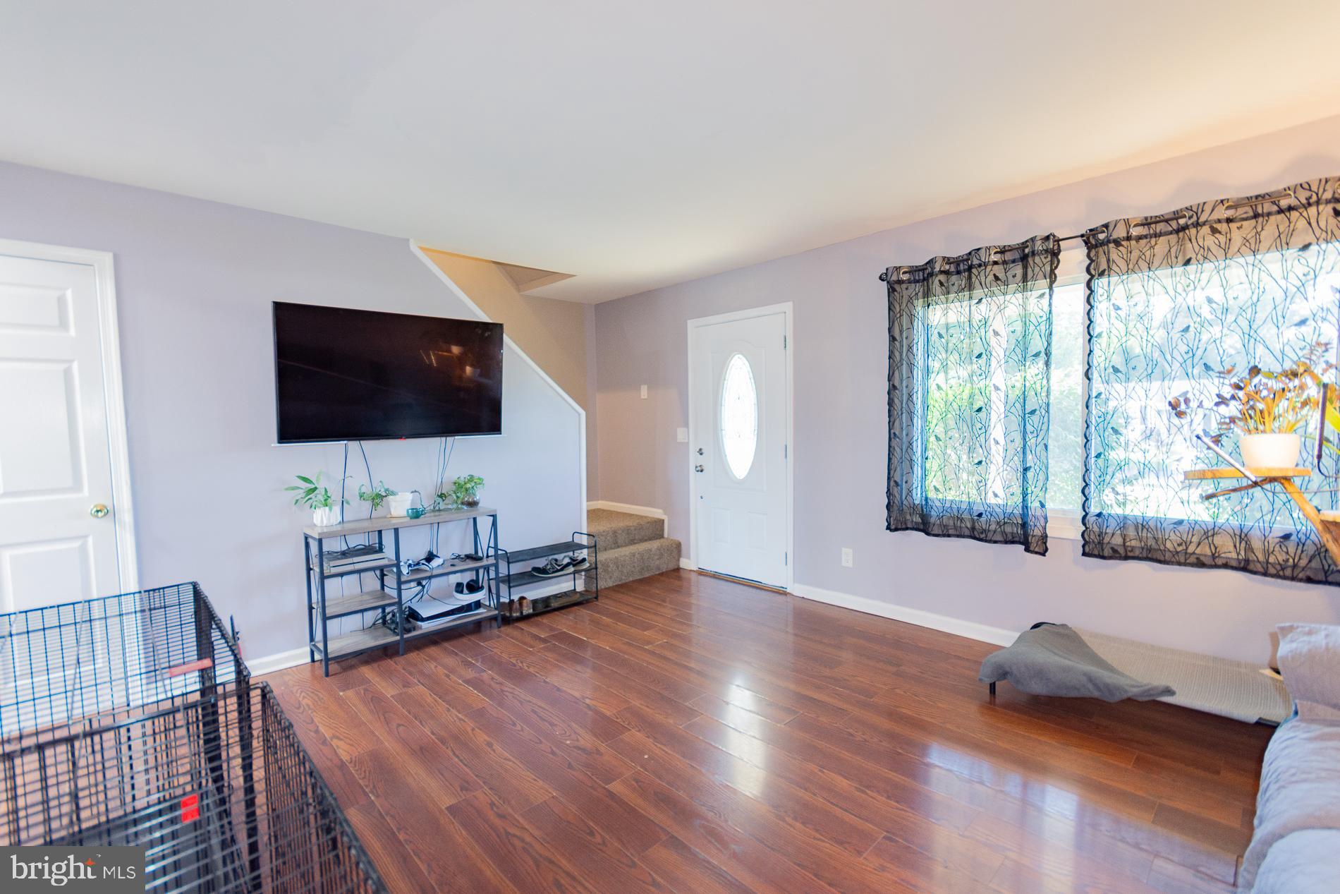 306 East 12th Avenue, Unit B Ranson, WV 25438 - Photo 5 of 31 a living room with furniture and a flat screen tv