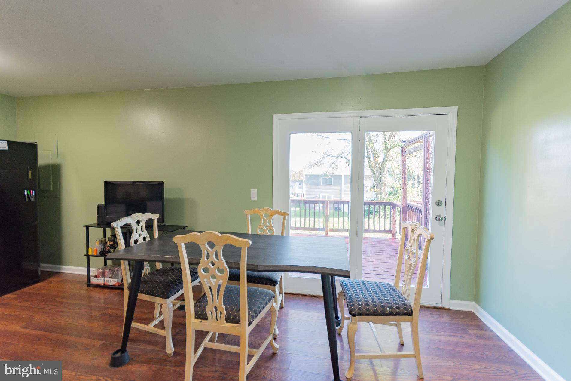 306 East 12th Avenue, Unit B Ranson, WV 25438 - Photo 6 of 31 a view of a dining room with furniture and wooden floor