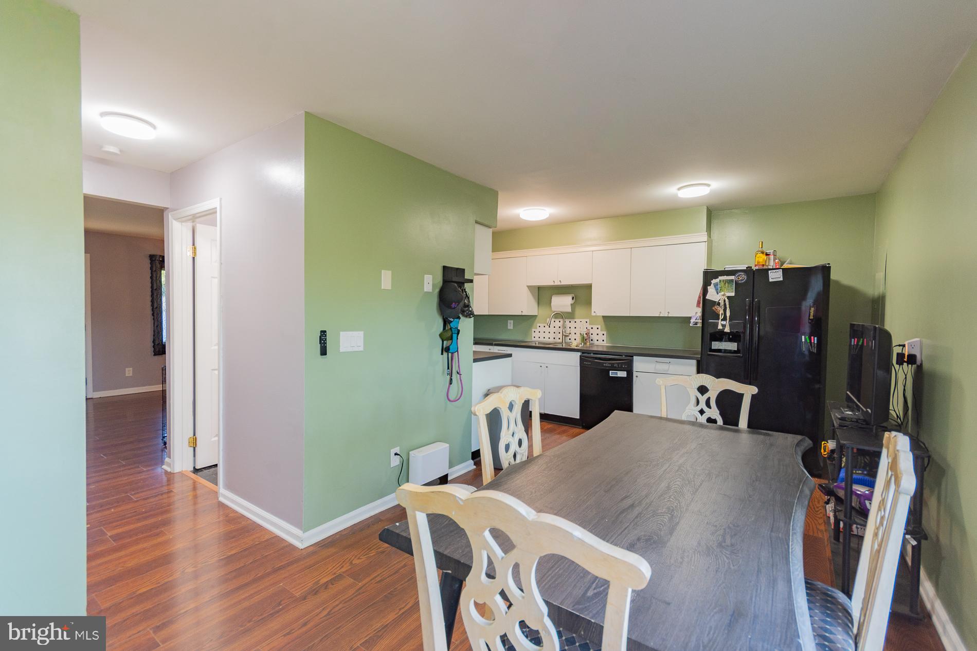 306 East 12th Avenue, Unit B Ranson, WV 25438 - Photo 7 of 31 a view of a dining room with furniture and wooden floor